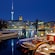 Boats in a river with the Berlin TV Tower in the distance
